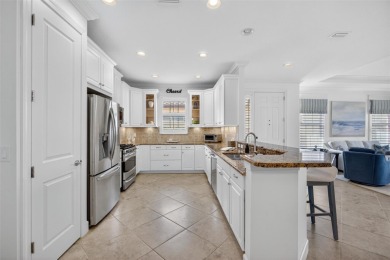Luxuriously Upgraded Roma Model with Pond Views & Room for a on Esplanade Golf and Country at Lakewood Ranch in Florida - for sale on GolfHomes.com, golf home, golf lot