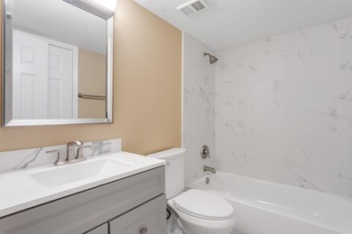 One or more photo(s) has been virtually staged. AS GOOD AS NEW! on Hunters Green Country Club in Florida - for sale on GolfHomes.com, golf home, golf lot