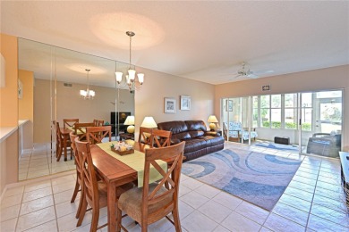 Welcome to this bright and airy first-floor condo in the on Peridia Golf and Country Club in Florida - for sale on GolfHomes.com, golf home, golf lot