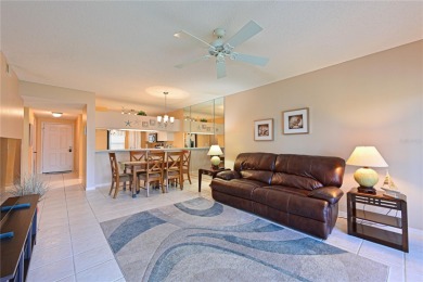 Welcome to this bright and airy first-floor condo in the on Peridia Golf and Country Club in Florida - for sale on GolfHomes.com, golf home, golf lot