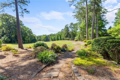 This custom executive home is not just a residence; it's a on Carolina Trace Country Club in North Carolina - for sale on GolfHomes.com, golf home, golf lot