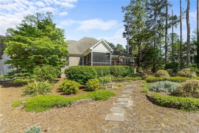 This custom executive home is not just a residence; it's a on Carolina Trace Country Club in North Carolina - for sale on GolfHomes.com, golf home, golf lot