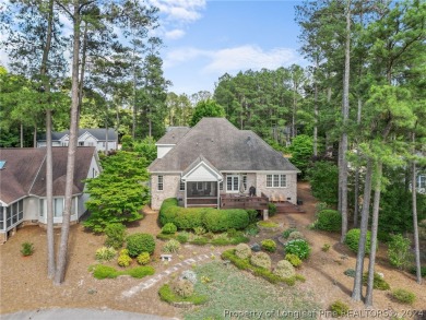 This custom executive home is not just a residence; it's a on Carolina Trace Country Club in North Carolina - for sale on GolfHomes.com, golf home, golf lot