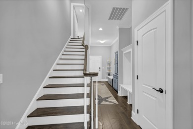 This exceptional home blends refined finishes, thoughtful design on Cape Fear National At Brunswick Forest in North Carolina - for sale on GolfHomes.com, golf home, golf lot