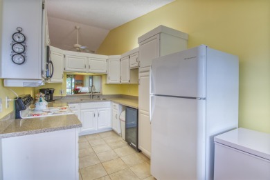 Welcome to this inviting golf-view unit! An updated kitchen on The Golf Club of Jupiter in Florida - for sale on GolfHomes.com, golf home, golf lot