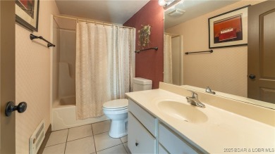 SPACIOUS, GREAT LOCATION, VIEW OF GOLF COURSE AND LAKE - This on The Oaks Golf Course in Missouri - for sale on GolfHomes.com, golf home, golf lot