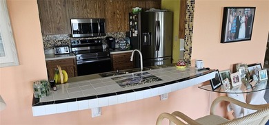 Located in the very desirable and affordable Mainlands of on Mainlands Golf Club in Florida - for sale on GolfHomes.com, golf home, golf lot