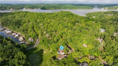 SPACIOUS, GREAT LOCATION, VIEW OF GOLF COURSE AND LAKE - This on The Oaks Golf Course in Missouri - for sale on GolfHomes.com, golf home, golf lot