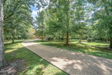 Discover luxury and tranquility at 234 Beech Point Dr., nestled on Sound Golf Links at Albemarle Plantation in North Carolina - for sale on GolfHomes.com, golf home, golf lot