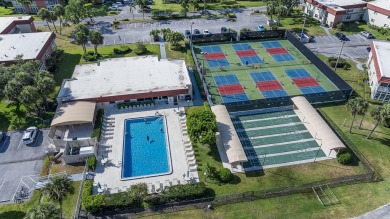 This well kept corner unit offers 1 bed, 1.5 bath- just steps on The American Golf Club in Florida - for sale on GolfHomes.com, golf home, golf lot