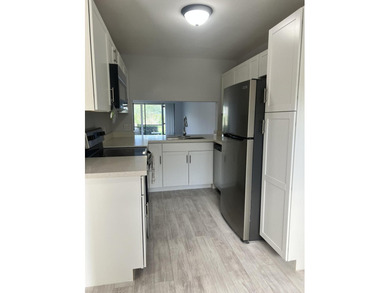 First-floor, fully updated condo with beautiful views and true on The Golf Club of Jupiter in Florida - for sale on GolfHomes.com, golf home, golf lot