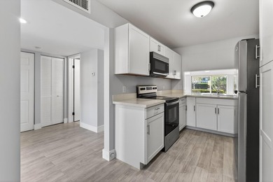 First-floor, fully updated condo with beautiful views and true on The Golf Club of Jupiter in Florida - for sale on GolfHomes.com, golf home, golf lot