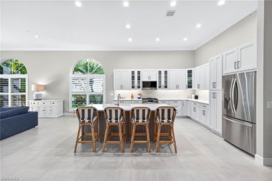 Discover the pinnacle of luxury living in this beautifully on West Bay Beach and Golf Club in Florida - for sale on GolfHomes.com, golf home, golf lot