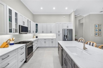 Discover the pinnacle of luxury living in this beautifully on West Bay Beach and Golf Club in Florida - for sale on GolfHomes.com, golf home, golf lot