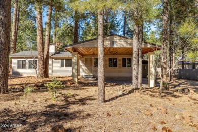Escape to mountain bliss in this 3-bedroom, 2-bathroom retreat on Pinetop Lakes Golf and Country Club in Arizona - for sale on GolfHomes.com, golf home, golf lot