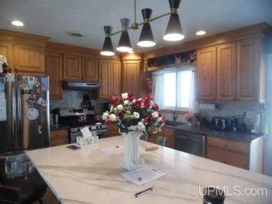 Charming 3-Bedroom, 2-Bath Bi-Level Home on the Golf Course! on Escanaba Country Club in Michigan - for sale on GolfHomes.com, golf home, golf lot