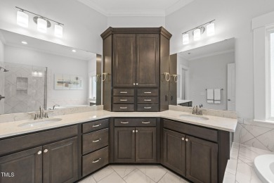 Nestled in the prestigious Hasentree Country Club community on Hasentree Club in North Carolina - for sale on GolfHomes.com, golf home, golf lot