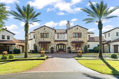 Welcome to this grand residence nestled on a sprawling 1.17 acre on Isleworth Golf and Country Club in Florida - for sale on GolfHomes.com, golf home, golf lot