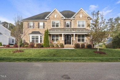 Nestled in the prestigious Hasentree Country Club community on Hasentree Club in North Carolina - for sale on GolfHomes.com, golf home, golf lot