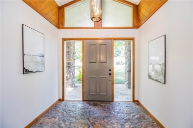 This exquisite, partially-wooded Mid Century Modern Ranch style on Fayetteville Country Club in Arkansas - for sale on GolfHomes.com, golf home, golf lot