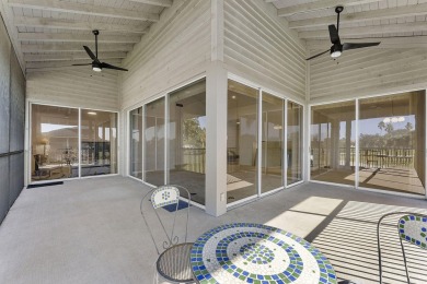 Step through the double-door entry into this stunning 2nd-floor on Boca Pointe Country Club in Florida - for sale on GolfHomes.com, golf home, golf lot