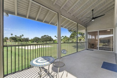 Step through the double-door entry into this stunning 2nd-floor on Boca Pointe Country Club in Florida - for sale on GolfHomes.com, golf home, golf lot