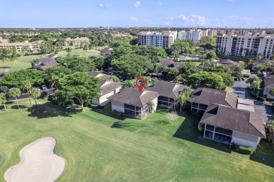 Step through the double-door entry into this stunning 2nd-floor on Boca Pointe Country Club in Florida - for sale on GolfHomes.com, golf home, golf lot