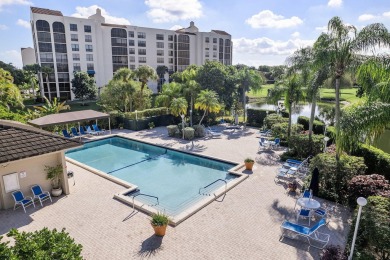 Step through the double-door entry into this stunning 2nd-floor on Boca Pointe Country Club in Florida - for sale on GolfHomes.com, golf home, golf lot