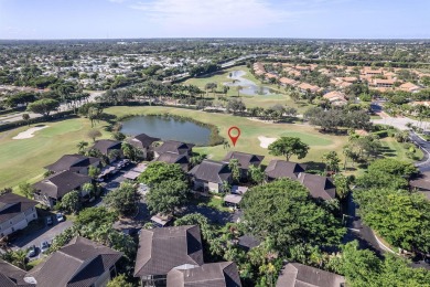 Step through the double-door entry into this stunning 2nd-floor on Boca Pointe Country Club in Florida - for sale on GolfHomes.com, golf home, golf lot