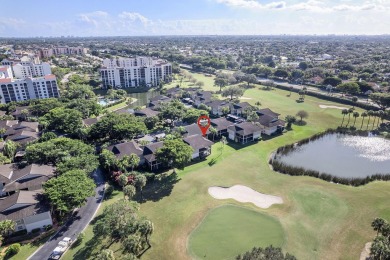 Step through the double-door entry into this stunning 2nd-floor on Boca Pointe Country Club in Florida - for sale on GolfHomes.com, golf home, golf lot