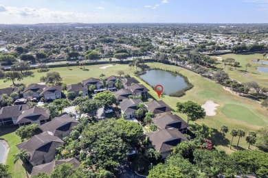 Step through the double-door entry into this stunning 2nd-floor on Boca Pointe Country Club in Florida - for sale on GolfHomes.com, golf home, golf lot