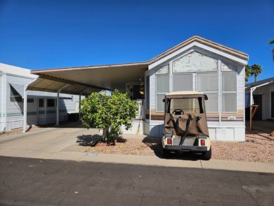 Situated in the vibrant Viewpoint Golf Resort 55+ community on Viewpoint Golf Resort in Arizona - for sale on GolfHomes.com, golf home, golf lot