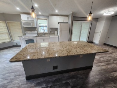 WELCOME HOME! You have found your dream retirement home in the on Golden Lakes Golf Course in Florida - for sale on GolfHomes.com, golf home, golf lot