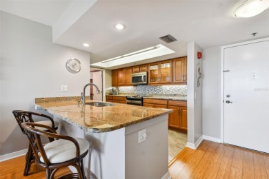 TURNKEY with GOLF & WATERFRONT VIEWS -- This beautifully on Isla Del Sol Yacht and Country Club in Florida - for sale on GolfHomes.com, golf home, golf lot