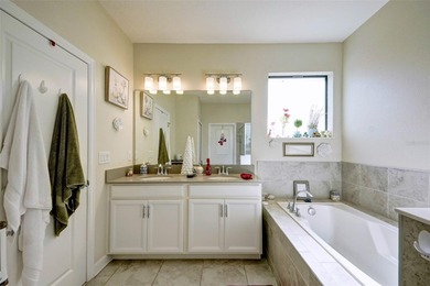 This beautifully maintained 3-bedroom, 2.5-bathroom townhome on ChampionsGate Golf Resort in Florida - for sale on GolfHomes.com, golf home, golf lot