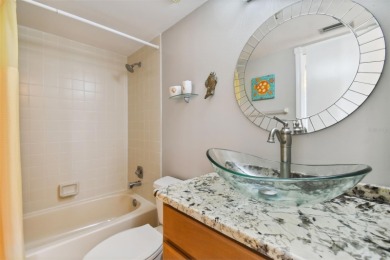 TURNKEY with GOLF & WATERFRONT VIEWS -- This beautifully on Isla Del Sol Yacht and Country Club in Florida - for sale on GolfHomes.com, golf home, golf lot