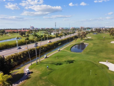 TURNKEY with GOLF & WATERFRONT VIEWS -- This beautifully on Isla Del Sol Yacht and Country Club in Florida - for sale on GolfHomes.com, golf home, golf lot