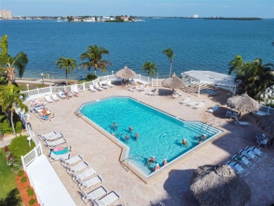 TURNKEY with GOLF & WATERFRONT VIEWS -- This beautifully on Isla Del Sol Yacht and Country Club in Florida - for sale on GolfHomes.com, golf home, golf lot