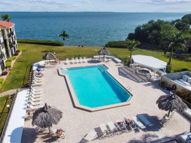TURNKEY with GOLF & WATERFRONT VIEWS -- This beautifully on Isla Del Sol Yacht and Country Club in Florida - for sale on GolfHomes.com, golf home, golf lot