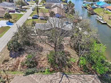 Start with the water. Build the rest.

This 80 by 125 foot on Palm Harbor Golf Club in Florida - for sale on GolfHomes.com, golf home, golf lot