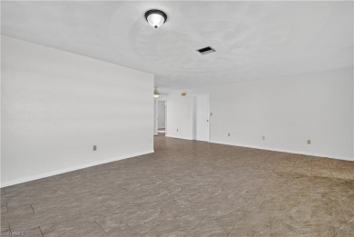 Welcome to this beautifully maintained 3-bedroom, 2-bathroom on San Carlos Golf Club in Florida - for sale on GolfHomes.com, golf home, golf lot