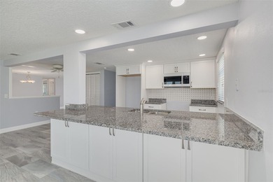 One or more photo(s) has been virtually staged. One or more on Gulf Harbors Golf Course in Florida - for sale on GolfHomes.com, golf home, golf lot