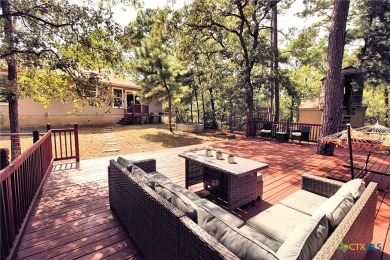 Special setting in Tahitian Village! 2016 built home overlooks a on Pine Forest Golf Club in Texas - for sale on GolfHomes.com, golf home, golf lot