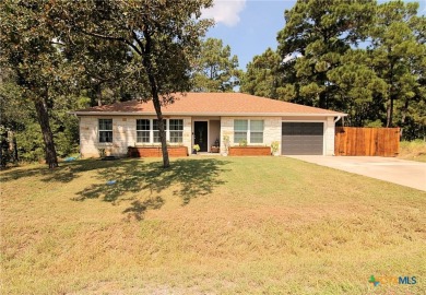 Special setting in Tahitian Village! 2016 built home overlooks a on Pine Forest Golf Club in Texas - for sale on GolfHomes.com, golf home, golf lot