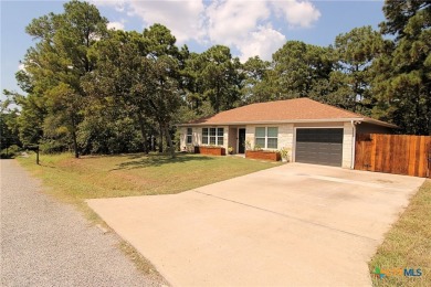 Special setting in Tahitian Village! 2016 built home overlooks a on Pine Forest Golf Club in Texas - for sale on GolfHomes.com, golf home, golf lot