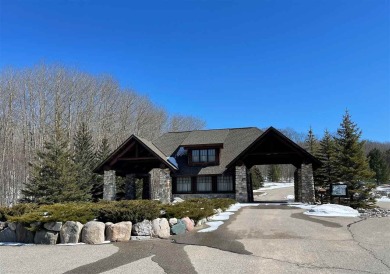 Enjoy living in the heart of northern Michigan's ski and golf on Boyne Highlands Golf Courses in Michigan - for sale on GolfHomes.com, golf home, golf lot