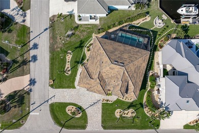 SHOWCASE HOME W/A WATER VIEW IN PGI! Check out this exceptional on Saint Andrews South Golf Club in Florida - for sale on GolfHomes.com, golf home, golf lot