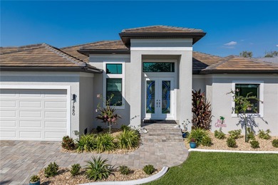 SHOWCASE HOME W/A WATER VIEW IN PGI! Check out this exceptional on Saint Andrews South Golf Club in Florida - for sale on GolfHomes.com, golf home, golf lot