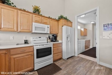This spacious townhome is gorgeous and ideally positioned in on Wolf Creek At Paradise Canyon in Nevada - for sale on GolfHomes.com, golf home, golf lot