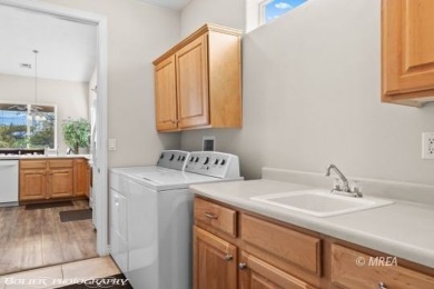 This spacious townhome is gorgeous and ideally positioned in on Wolf Creek At Paradise Canyon in Nevada - for sale on GolfHomes.com, golf home, golf lot